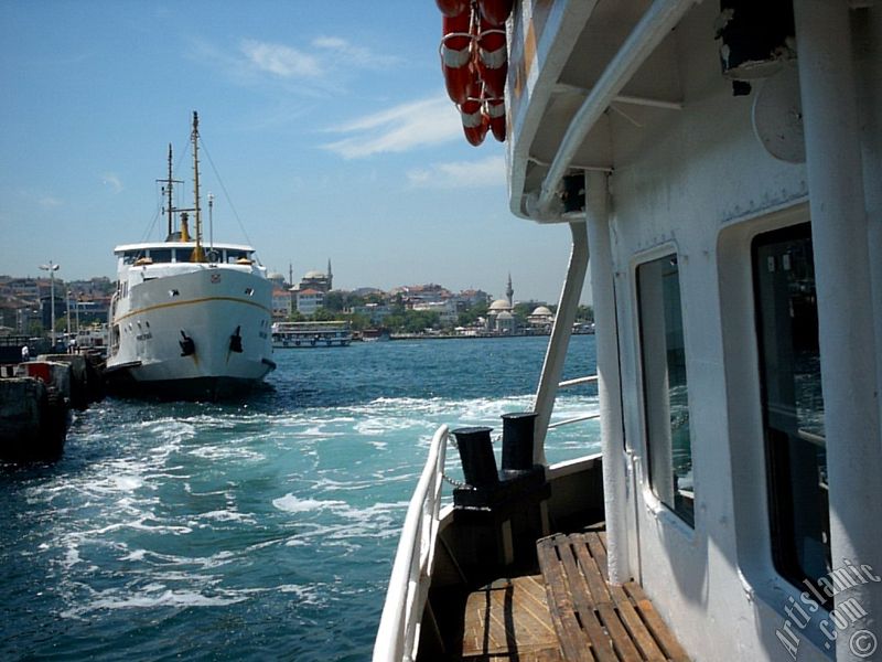 View of the ships, Uskudar jetty and Uskudar shore from the Bosphorus in Istanbul city of Turkey.
