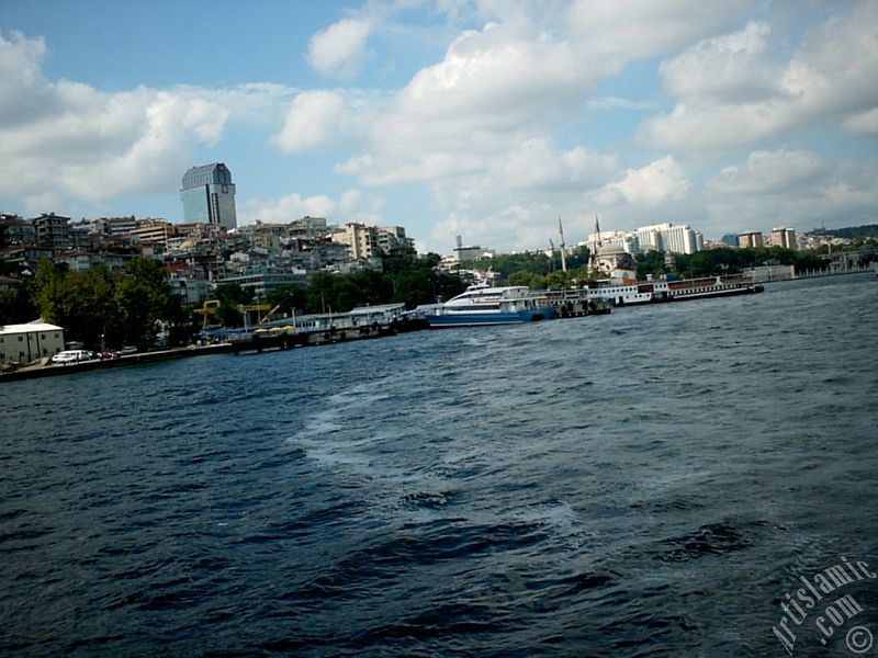 View of Kabatas coast and Valide Sultan Mosque at distant from the Bosphorus in Istanbul city of Turkey.
