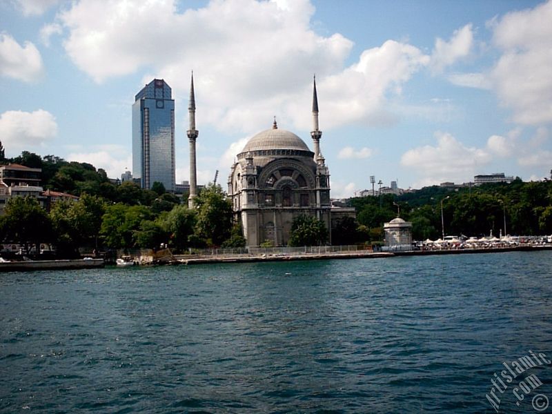 View of Dolmabahce coast and Valide Sultan Mosque from the Bosphorus in Istanbul city of Turkey.
