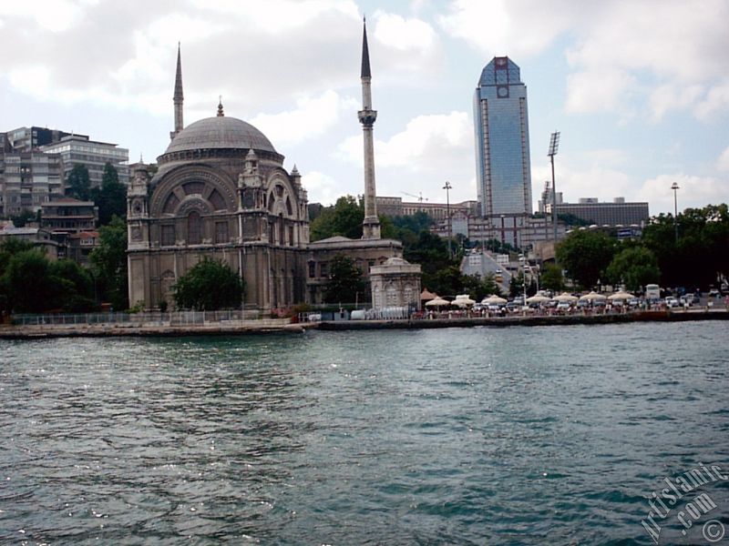 View of Dolmabahce coast and Valide Sultan Mosque from the Bosphorus in Istanbul city of Turkey.
