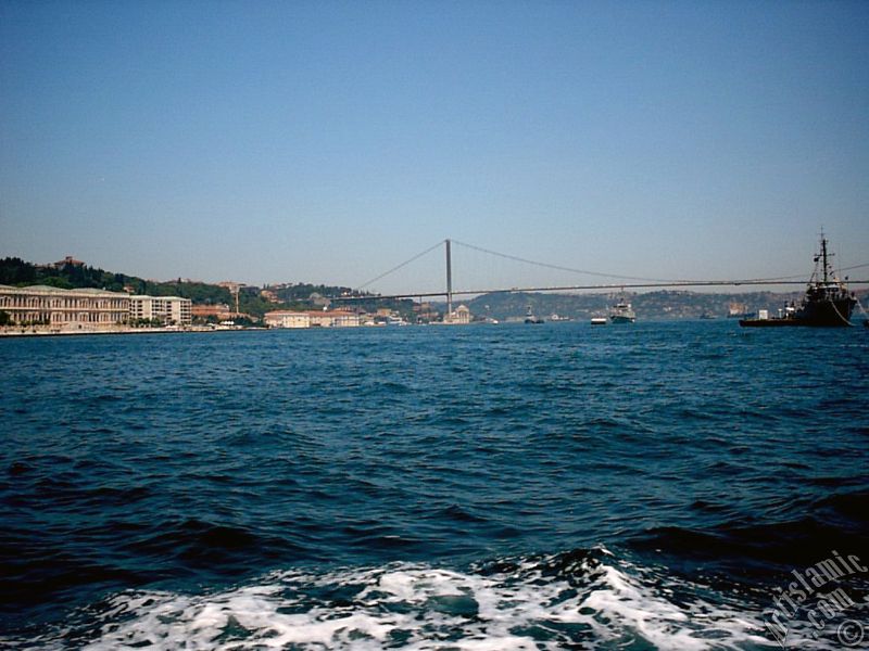 View of the Ciragan Palace and the Bosphorus Bridge from the Bosphorus in Istanbul city of Turkey.
