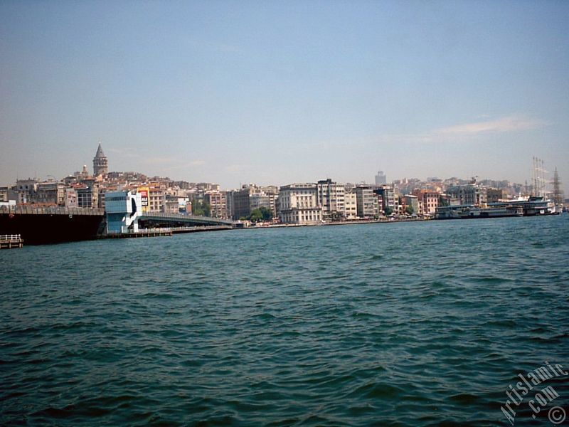 View of Karakoy coast, Galata Bridge and Galata Tower from the shore of Eminonu in Istanbul city of Turkey.

