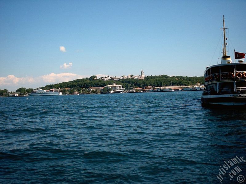 View of a ship waiting at Karakoy jetty and Topkapi Palace from the shore of Karakoy in Istanbul city of Turkey.
