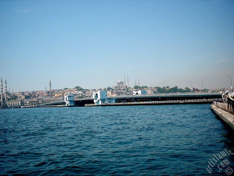 View of Eminonu coast, Yeni Cami (Mosque), (at far behind) Beyazit Mosque, Beyazit Tower, Galata Brigde and Suleymaniye Mosque from Karakoy jetty in Istanbul city of Turkey.
