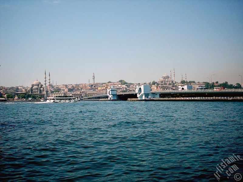 View of (from left) Yeni Cami (Mosque), (at far behind) Beyazit Mosque, Beyazit Tower, Galata Brigde and Suleymaniye Mosque from the shore of Karakoy in Istanbul city of Turkey.
