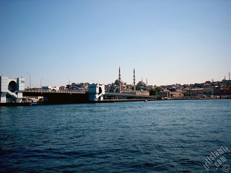 View of Eminonu coast, (from left) Galata Bridge, Yeni Cami (Mosque), Sultan Ahmet Mosque (Blue Mosque) and (below) Egyptian Bazaar (Spice Market) from the shore of Karakoy-Persembe Pazari in Istanbul city of Turkey.
