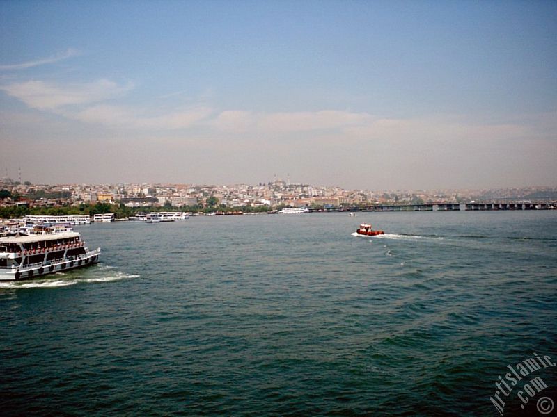 View of Sarachane coast, on the horizon on the left Fatih Mosque and in the middle Yavuz Sultan Selim Mosque from Galata Bridge located in Istanbul city of Turkey.
