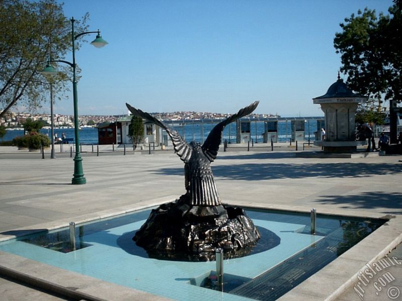 View of a park on the shore of Besiktas district and the coast of Uskudar on the horizon in Istanbul city of Turkey.
