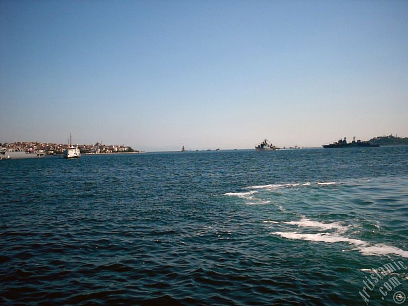View of froth on the sea seen after a ship landed, on the horizon Kiz Kulesi (Maiden`s Tower), Uskudar coast on the left and Sarayburnu coast on the rigth from the shore of Besiktas in Istanbul city of Turkey.
