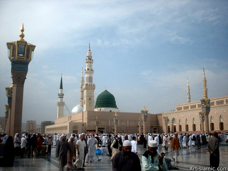 The Prophet Muhammad`s (saaw) Mosque (Masjed an-Nabawe) in Madina city of Saudi Arabia and the muslims going out of mosque after a prayer time.
