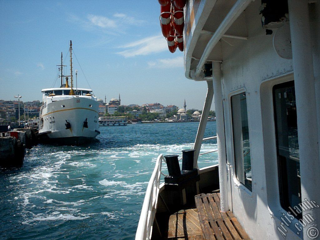 View of the ships, Uskudar jetty and Uskudar shore from the Bosphorus in Istanbul city of Turkey.
