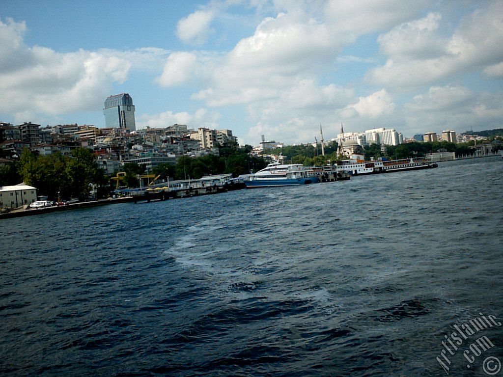 View of Kabatas coast and Valide Sultan Mosque at distant from the Bosphorus in Istanbul city of Turkey.
