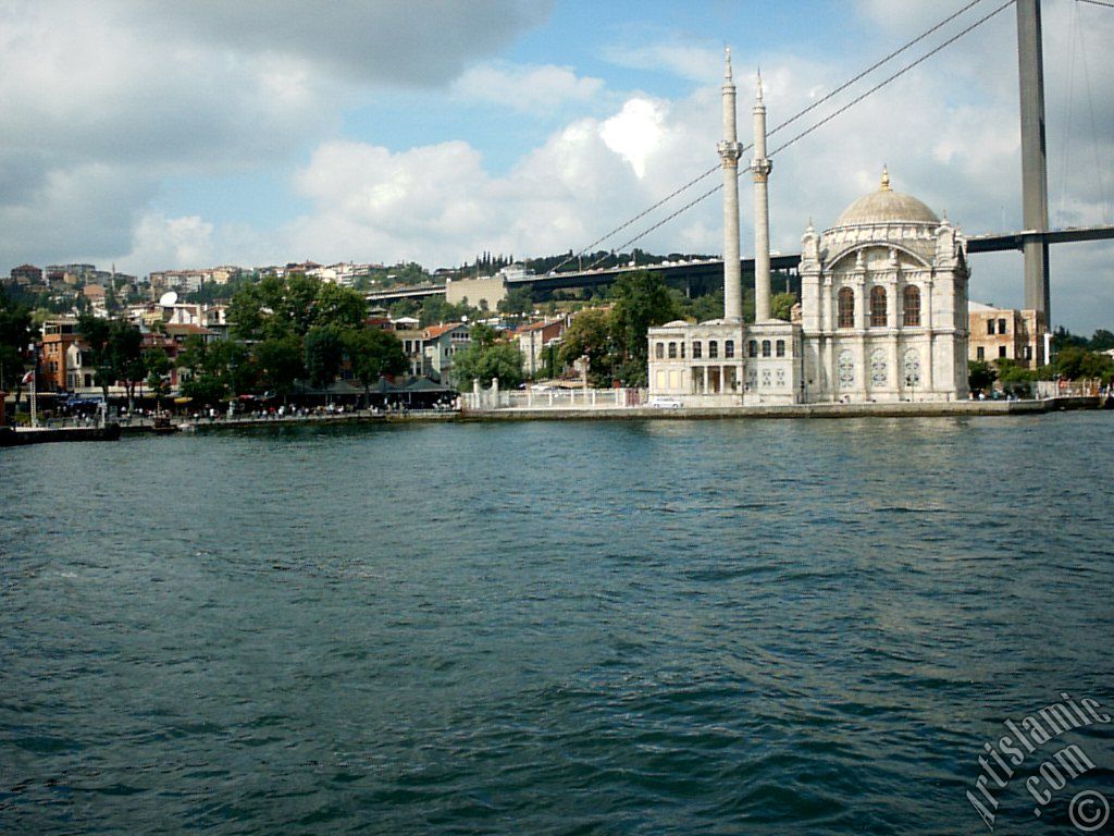 View of Ortakoy coast, Ortakoy Mosque and Bosphorus Bridge from the Bosphorus in Istanbul city of Turkey.
