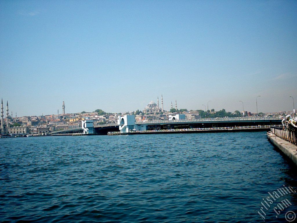 View of Eminonu coast, Yeni Cami (Mosque), (at far behind) Beyazit Mosque, Beyazit Tower, Galata Brigde and Suleymaniye Mosque from Karakoy jetty in Istanbul city of Turkey.
